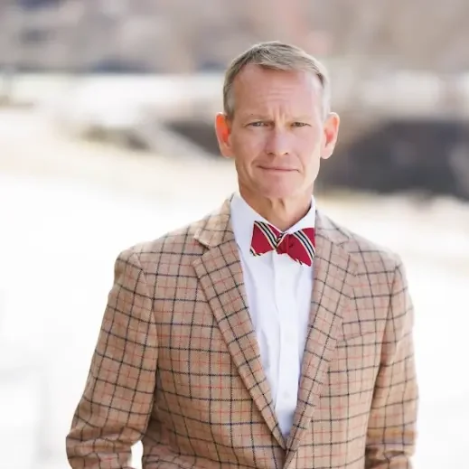 A professional headshot of Allen Clardy